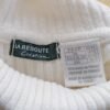 Etiquette du pull col roulé vintage blanc pour femme, taille S à M.