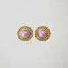 Boucles d'oreilles clips vintage dorées et rose nacré, vue de face.