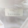 Etiquette de la chemise blanche sans manches pour femme, taille XS à S.
